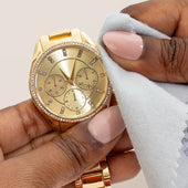 Clean + Care Polishing Cloth cleaning a gold watch