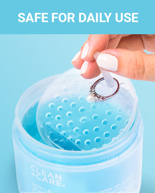 CLEAN+CARE Gentle Jewelry Cleaner in-use with pearl ring in dipping basket.
