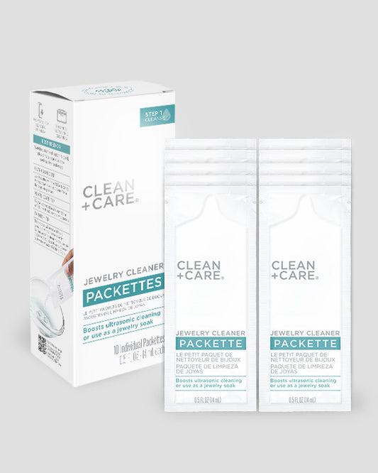 CLEAN+CARE Jewelry Cleaner Packettes box next to the 10 individual Packettes included.