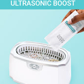 CLEAN+CARE Jewelry Cleaner Packette in use as an ultrasonic boost.
