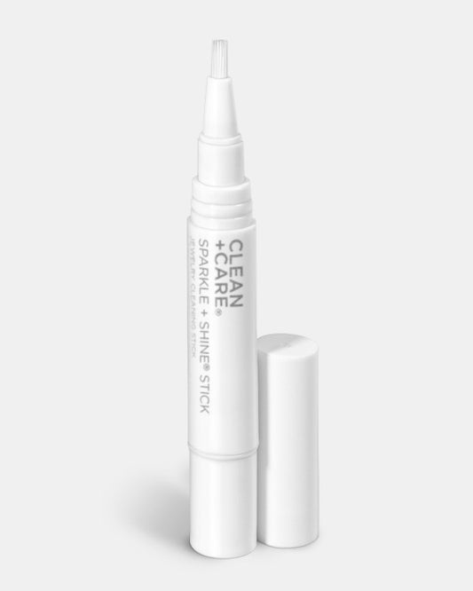 CLEAN+CARE Sparkle + Shine® Jewelry Cleaning Stick uncapped to showcase brush head.