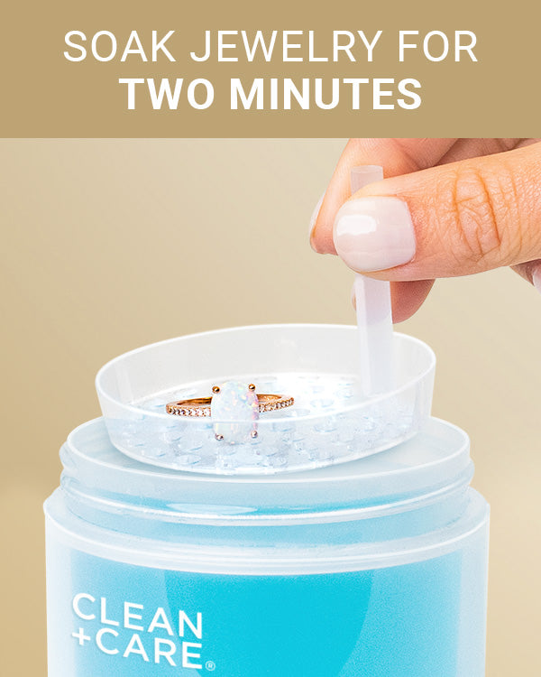 CLEAN+CARE Gentle Jewelry Cleaner in-use on an opal ring