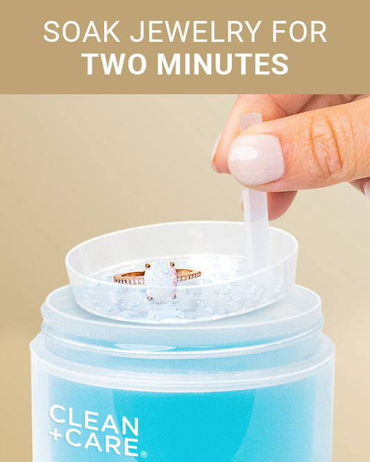 CLEAN+CARE Gentle Jewelry Cleaner in-use on an opal ring