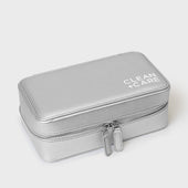 The CLEAN+CARE Jewelry Storage Case closed with secure zipper, showcasing its sleek size for keeping jewelry safe.