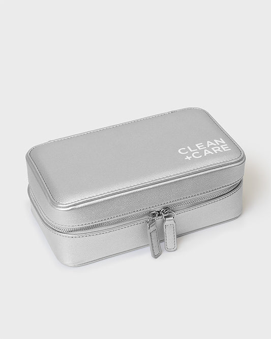 The CLEAN+CARE Jewelry Storage Case closed with secure zipper, showcasing its sleek size for keeping jewelry safe.