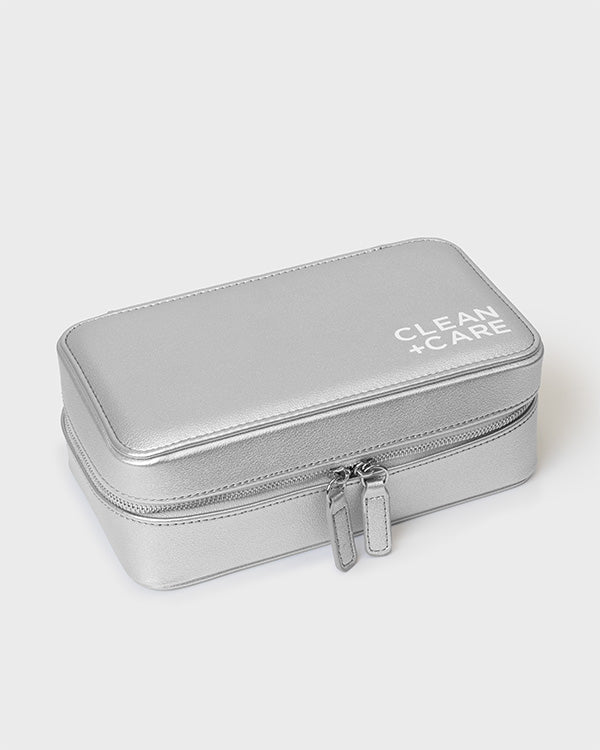 The CLEAN+CARE Jewelry Storage Case closed with secure zipper, showcasing its sleek size for keeping jewelry safe.