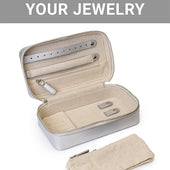 The CLEAN+CARE Jewelry Storage Case open, displaying compartments that safely separate jewelry and a removable pouch.