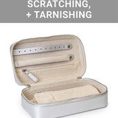 The CLEAN+CARE Jewelry Storage Case open, showing the removable pouch securely stored inside main compartment.