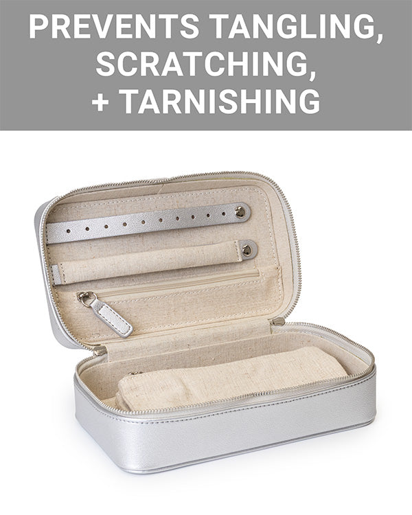 The CLEAN+CARE Jewelry Storage Case open, showing the removable pouch securely stored inside main compartment.