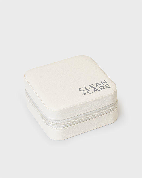 The CLEAN+CARE Jewelry Travel Case closed with secure zipper, showcasing its sleek, compact size for travel.