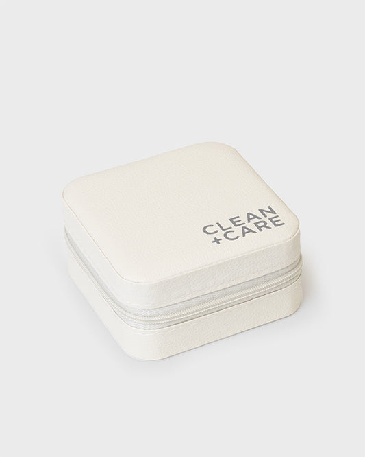 The CLEAN+CARE Jewelry Travel Case closed with secure zipper, showcasing its sleek, compact size for travel.