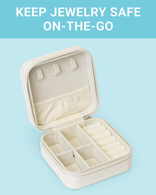 The CLEAN+CARE Jewelry Travel Case open, showing three sections with compartments that safely separate jewelry. 