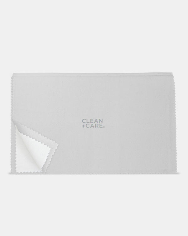 CLEAN+CARE 12x15 in. Professional Polishing Cloth out of packaging, with corner upturned to showcase treated inner layer