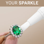 CLEAN+CARE Sparkle + Shine Jewelry Cleaning Stick in-use on an emerald ring