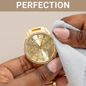 CLEAN+CARE Professional Polishing Cloth in-use on a gold watch